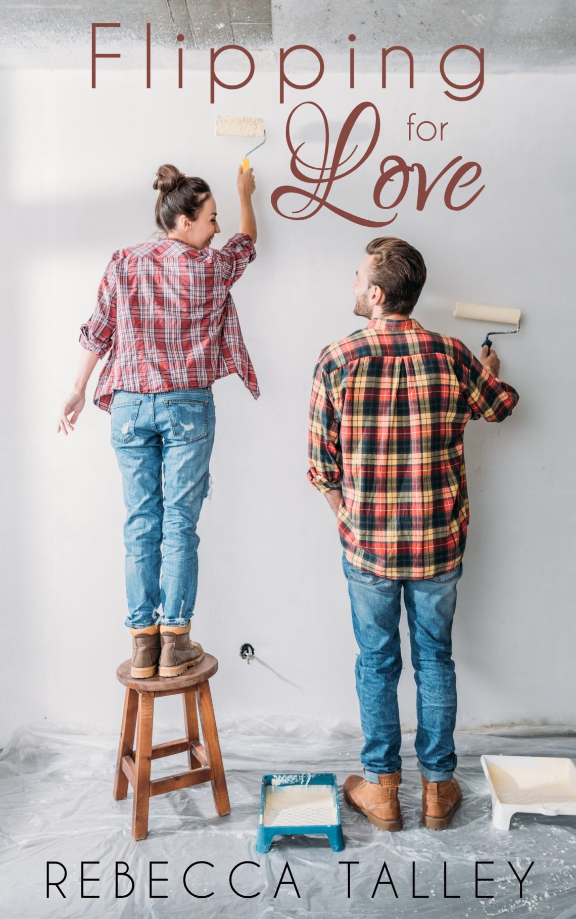 man and woman painting a room